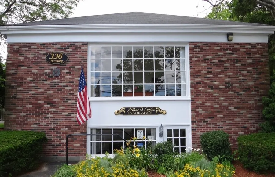 Calfee Insurance office exterior with American flag